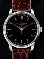 Fine IWC from 1955 with an extremely rare original black glossy dial & pink gold indexes and hands.