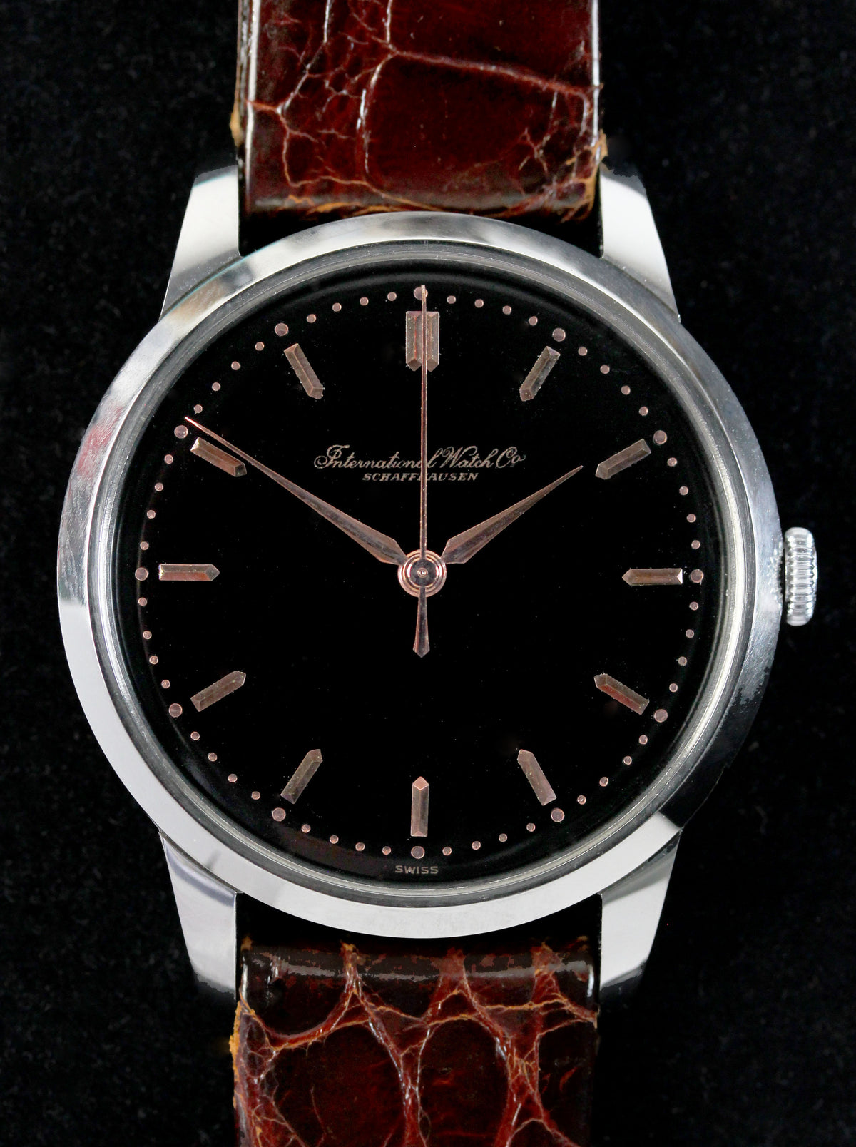 Fine IWC from 1955 with an extremely rare original black glossy dial & pink gold indexes and hands.