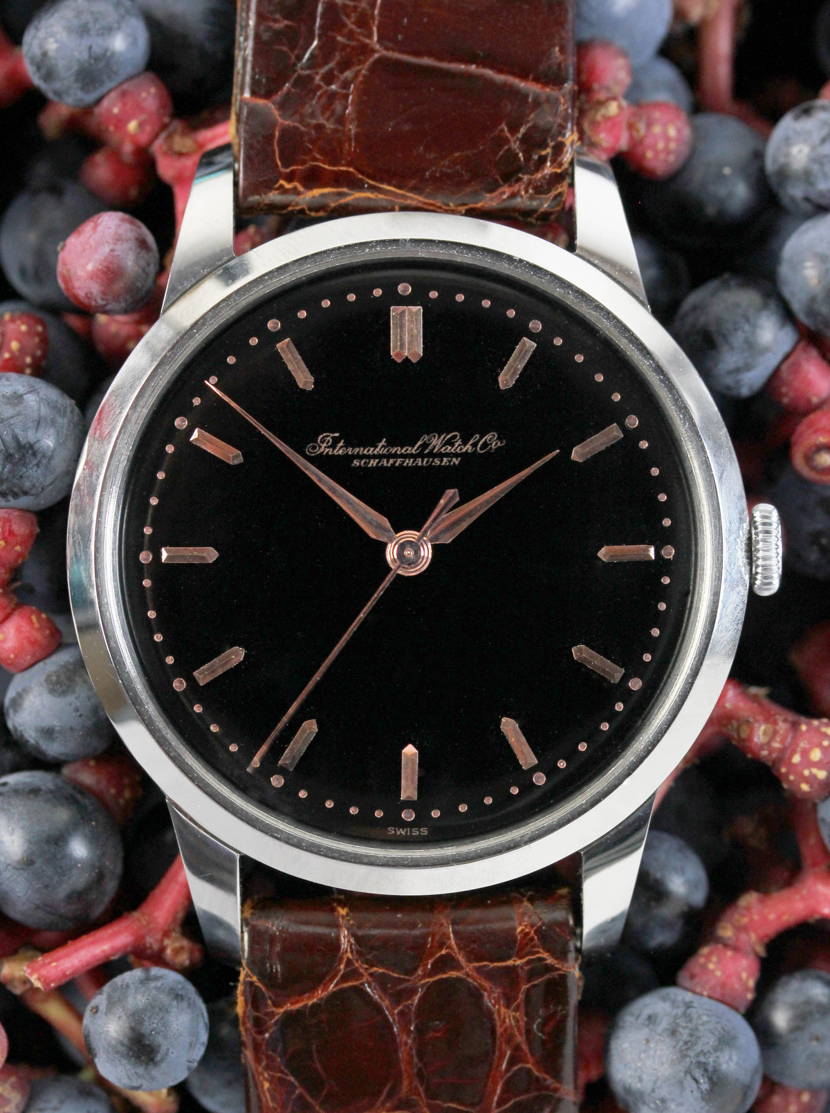 Fine IWC from 1955 with an extremely rare original black glossy dial & pink gold indexes and hands.