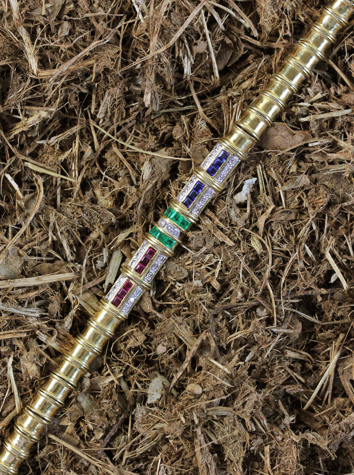 Fine  gold bracelet with rubies, emeralds, sapphires & diamonds
