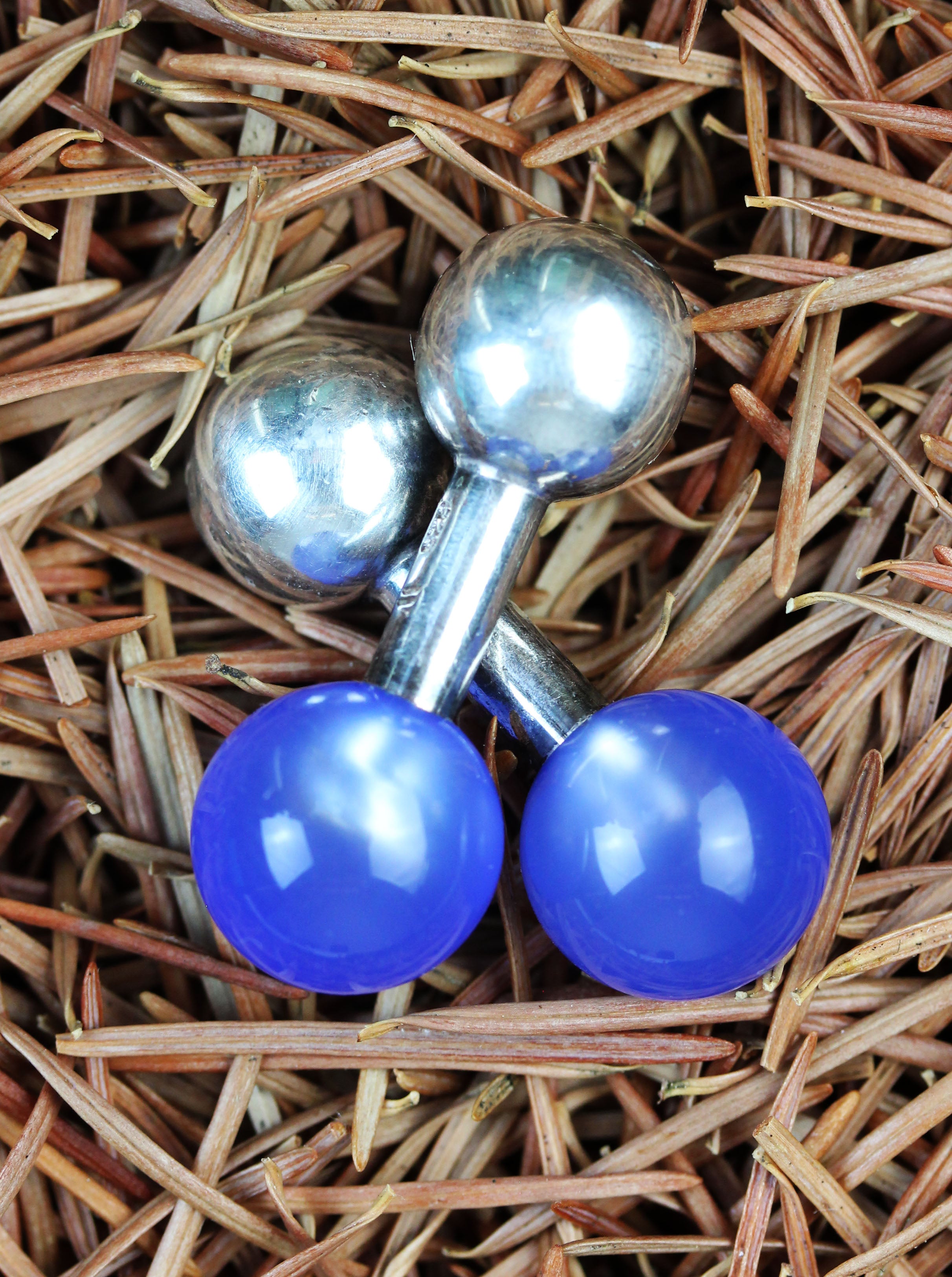 Pair of silver barbell cufflinks with blue agate